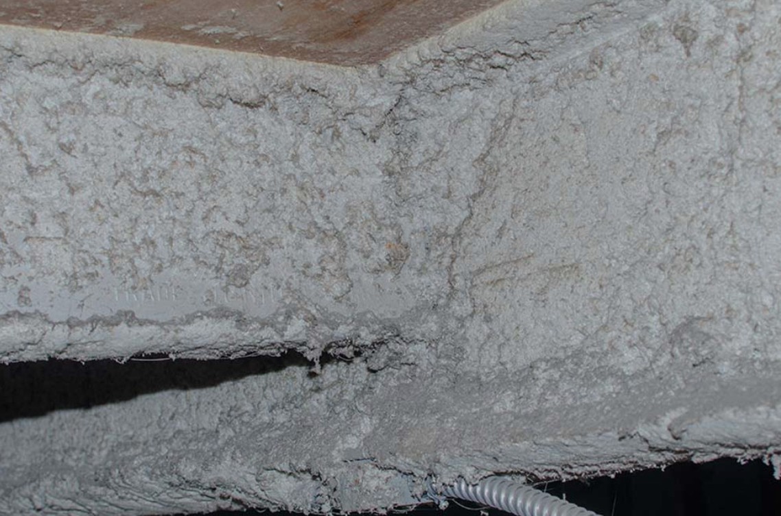 Asbestos-containing material in an older building showing the type of hazard covered during asbestos awareness training
